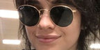 Camila Cabello was seen wearing gold Ray-Ban Round Metal RB 3447 001/58 sunglasses with green Polarised lenses.