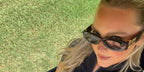 Sports Illustrated model Camille Kostek was seen wearing black Miu Miu MU 11WS 1AB5S0 sunglasses at the LIV Golf League in Miami, April 2025.