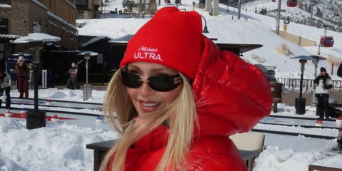 Sports Illustrated model Camille Kostek was seen wearing gold Miu Miu MU A51S 5AK5S0 rimless sunglasses at the Park City Utah Winter Olympics in February 2026.