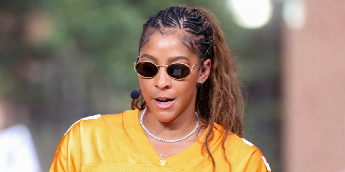 Basketball player Candace Parker was seen wearing Miu Miu MU 52YS 7OE01T oval sunglasses with dark brown lenses.