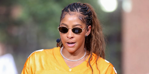 Basketball player Candace Parker was seen wearing Miu Miu MU 52YS 7OE01T oval sunglasses with dark brown lenses.