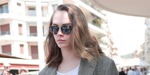 Cara Delevingne was seen wearing tortoiseshell Persol 3274S 108/56 Folding round sunglasses with blue lenses at the Cannes Film Festival 2024. Shop online now on Pretavoir