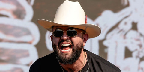 Mexican singer Carin Leon was seen wearing gold Ray-Ban RB 3719 001/31 sunglasses onstage at the Austin City Limits Music Festival 2024.