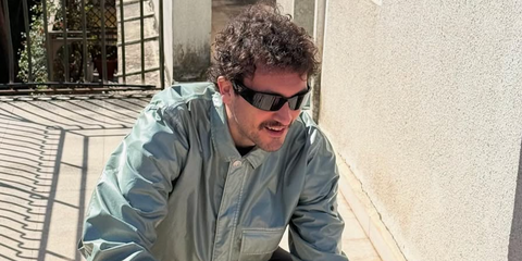 Italian singer Carl Brave was seen wearing black Prada PR A19S 1AB5S0 wraparound sunglasses in his Instagram post, April 2025. Shop online now on Pretavoir