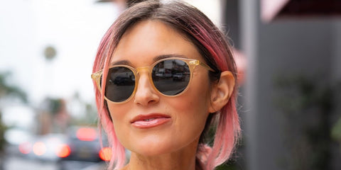 Actress and entrepreneur Caroline D'Amore of the Pizza Girl was seen wearing yellow Garrett Leight Clune 2047 B/SFBS sunglasses with blue lenses in her collaborative Instagram post with Garrett Leight in August 2025.