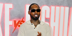 Rapper Castillo was seen wearing black Prada PR 17WS 1AB5S0 Symbole Sunglasses at the Jake Paul vs Anthony Joshua Netflix Live Event in Miami, December 2025.