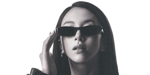 South Korean singer Chaeyoung of K-Pop group TWICE was seen wearing black Saint Laurent Sun SL 557 Shade 001 slim sunglasses.