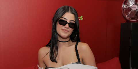 Charli D'Amelio was seen wearing black Miu Miu Regard MU 11ZS 16K5S0 Regard rectangular sunglasses at the Coachella Music Festival 2026.