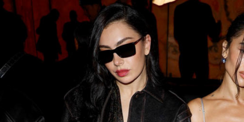 Charli XCX was seen wearing black and gold Saint Laurent SL 766 001 square sunglasses to attend the Saint Laurent Fall/Winter 2025 fashion show during Paris Fashion Week