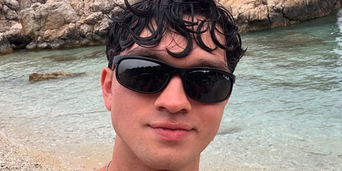 Young actor Charlie Bushnell was seen wearing the polarised version of Ray-Ban Predator 2 RB 2027 W1847 sunglasses in Greece, May 2025. Shop online now on Pretavoir