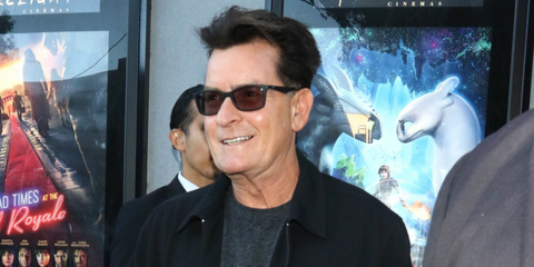 Actor Charlie Sheen was seen wearing matte black Ray-Ban RB 7047 5196 optical glasses with prescribed tinted lenses in Los Angeles. Shop online now on Pretavoir