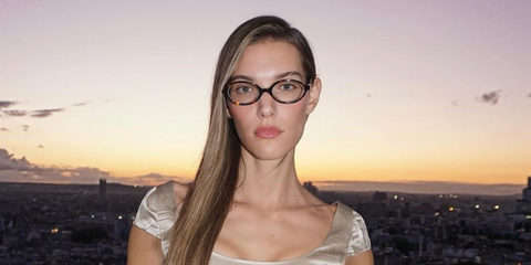 Canadian singer Charlotte Cardin was seen wearing tortoiseshell Miu Miu MU 01XV VAU1O1 oval optical glasses during Paris Fashion Week season Spring/Summer 2025