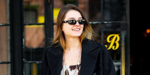 Actress Charlotte Lawrence was seen wearing black Prada PR B06S 16K08Z sunglasses in New York City, April 2025. Shop online now on Pretavoir