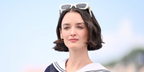 Charlotte Le Bon was seen wearing white Miu Miu MU 09WS 1425S0 cat eye sunglasses to the 2023 Cannes Film Festival