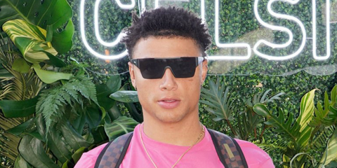 Professional boxer and reality TV star Chase DeMoor was seen wearing black Burberry BE4291 346487 shield sunglasses at the CELSIUS Tropical Vibe Flavor Launch VIP Event in Miami.