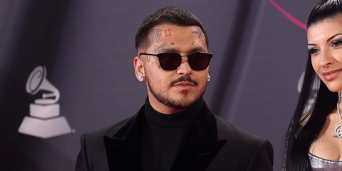 Mexican singer Christian Nodal was seen wearing black Saint Laurent Sun SL 28 Metal 001 sunglasses at the Latin Grammy Awards 2022.