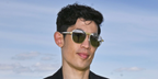 Australian actor Christopher Chung was seen wearing gold and silver Cartier Santos CT0532S 001 sunglasses with grey lenses at the Cartier Queen's Polo Cup 2026 in Egham, England.