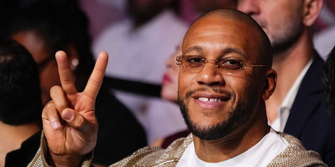 French mixed martial artist Ciryl Gane was seen wearing gold Cartier Piccadilly CT0092O 001 'Big C' rimless glasses at a UFC Fight Night event in Doha, Qatar, November 2025. 
