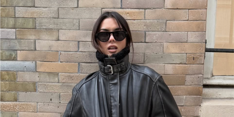 Content creator Clara Kong Vila was seen wearing black Prada PR B15S 16K731 sunglasses in Paris, shared through her Instagram post in December 2025.