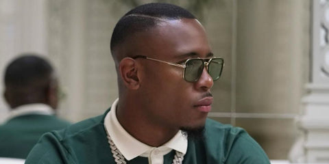 French footballer Claude Dielna was seen wearing Dita Flight.008 DTS 134 02 sunglasses with green lenses in Paris, June 2022, shared on Instagram. Shop online now on Pretavoir