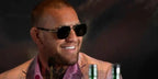 Conor McGregor was seen wearing gold and black Gucci GG0529S 001 aviator sunglasses