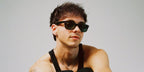 Singer Corbyn Besson was seen wearing black Ray-Ban New Wayfarer RB 2132 901 sunglasses in his Instagram post, October 2025.