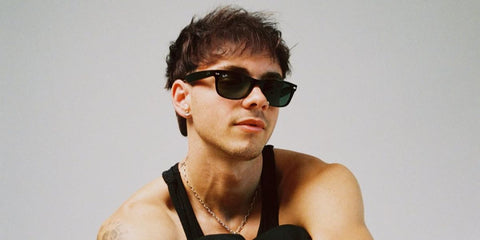 Singer Corbyn Besson was seen wearing black Ray-Ban New Wayfarer RB 2132 901 sunglasses in his Instagram post, October 2025.