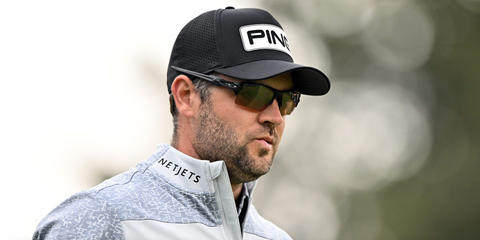 Canadian professional golfer Corey Conners was seen wearing black Oakley Flak 2.0 XL OO9188 90 Prizm sunglasses.