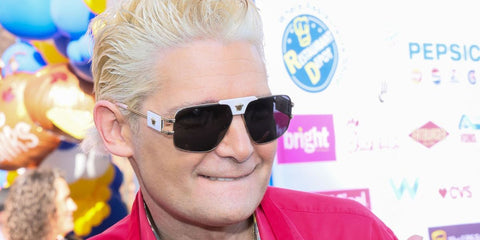 Actor and singer Corey Feldman was seen wearing white and gold Versace 2251 1471/87 sunglasses at the Los Angeles Mission Thanksgiving Dinner in November 2024.