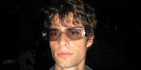 Italian model and internet personality Corrado Martini was seen wearing transparent Prada PR 17WS 19X30N sunglasses at the Sound of Prada event in Berlin, June 2025.