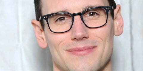 Cory Michael Smith was seen wearing matte black and gold Dita Buckeye (+) DTX 149 01 optical glasses