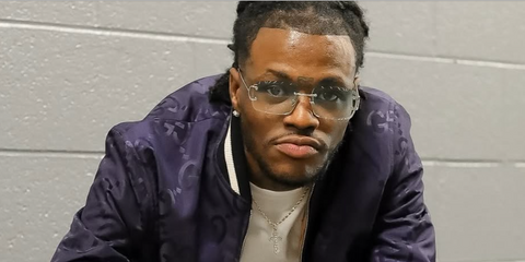 Comedian and actor D.C. Young Fly was seen wearing silver Cartier CT0488S 001 rimless sunglasses with clear Blue & Beyond Photochromic lenses in his Instagram post, March 2026.