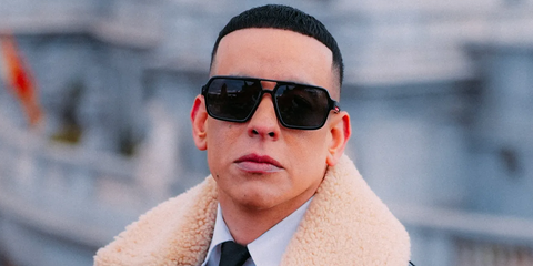 Daddy Yankee was seen wearing black Prada Linea Rossa SPS A06 1AB02G aviator sunglasses with dark grey Polarised lenses in a Rolling Stone Magazine feature, February 2026.