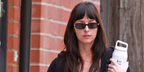 Dakota Johnson wore black and gold Valentino VG0047S 001 rectangular sunglasses in October 2026
