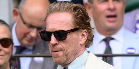Damian Lewis was seen wearing tortoiseshell Persol 3386S 24/B1 sunglasses with grey lenses at the Wimbledon Tennis Championships 2026.