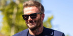 David Beckham wore black David Beckham Eyewear DB 99/MIAMI 807/KE sunglasses with pink Photochromic lenses at the F1 Spanish Grand Prix 2026