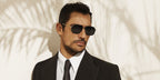 David Gandy was seen modeling gold and black Dolce&Gabbana DG2285 02/81 Polarised aviator sunglasses in Dolce & Gabbana Eyewear Spring/Summer 2022 campaign