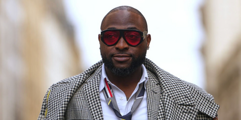 Nigerian singer-songwriter Davido was seen wearing Tom Ford Bronson TF1044 52S sunglasses with red lenses at the Thom Browne Spring/Summer 2026 fashion show during Paris Fashion Week. Shop online now on Pretavoir