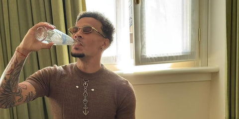 Footballer Dele Alli was seen wearing gold and tortoiseshell Prada PR B54S 5AK50P rectangular sunglasses with brown lenses during Milan Men's Fashion Week season Spring/Summer 2026. Shop online now on Pretavoir