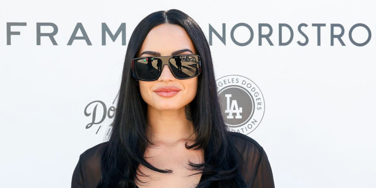Demi Lovato was seen wearing black Saint Laurent Sun SL 832 001 sunglasses at the Baby2Baby Holiday Distribution in Los Angeles, December 2025.