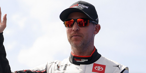 Denny Hamlin was seen wearing black Oakley Flak 2.0 Xl OO9188 91 sunglasses with Prizm lenses at the NASCAR Cup Series Goodyear 400 in Darlington, South Carolina, April 2025