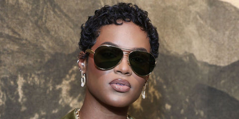 Model Didi Stone was seen wearing gold Bottega Veneta BV1305S 001 Sardine aviator sunglasses at the AMIRI Spring/Summer 2027 fashion show during Paris Men's Fashion Week.