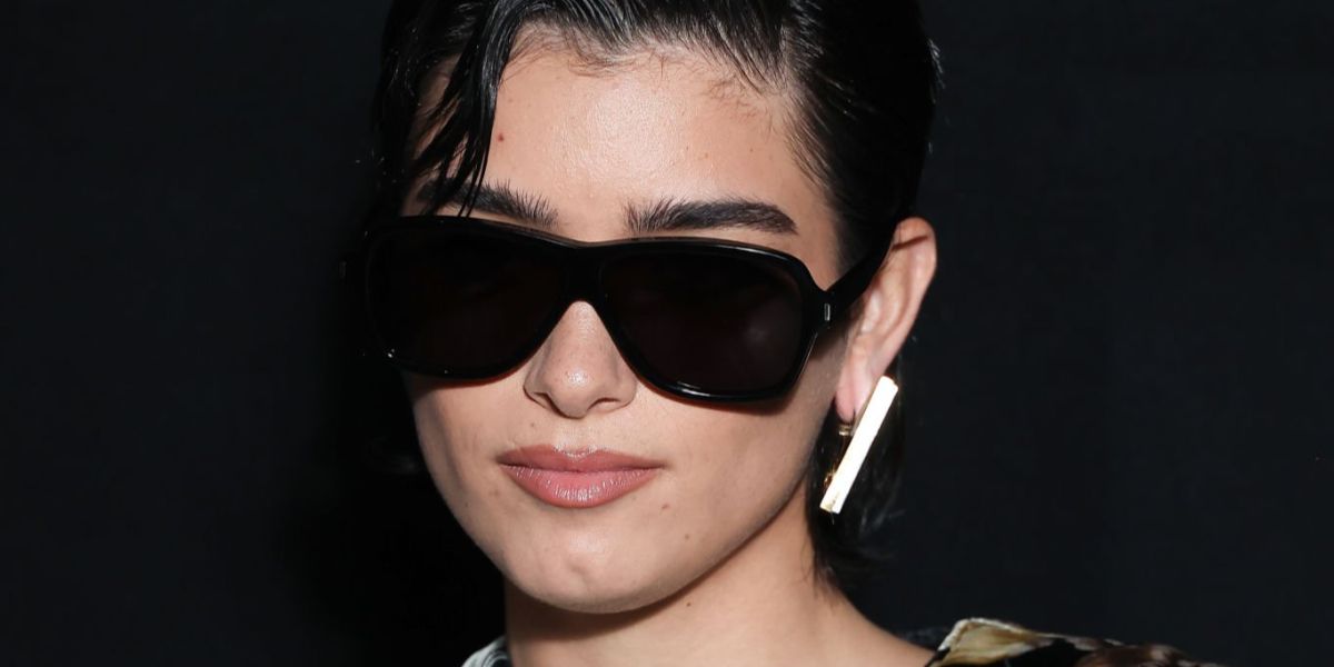 Dixie D'Amelio was seen wearing black Saint Laurent Sun SL 609 Carolyn 001 sunglasses at the Saint Laurent Spring/Summer 2024 fashion show during Paris Fashion Week.