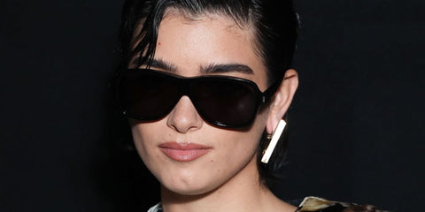 Dixie D'Amelio was seen wearing black Saint Laurent Sun SL 609 Carolyn 001 sunglasses at the Saint Laurent Spring/Summer 2024 fashion show during Paris Fashion Week.