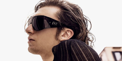 Italian actor Domenico Cuomo was seen wearing black and ruthenium Dsquared2 D2 0124/S ANSIR shield sunglasses in the Dsquared2 Eyewear Spring/Summer 2024 campaign. Shop online now on Pretavoir