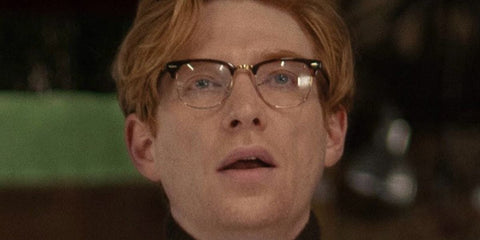 Domhnall Gleeson was seen wearing black Ray-Ban Clubmaster Optical RB 5154 2000 half-rim optical glasses in Apple TV+ 2025 movie "Fountain of Youth"