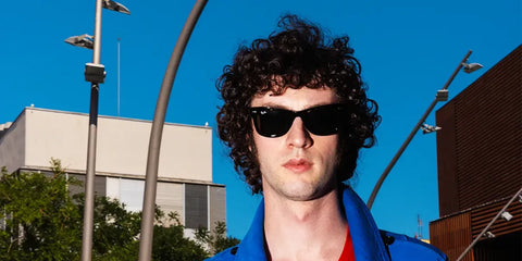 Dominic Sessa was seen wearing the iconic Ray-Ban Wayfarer 2140 901 Black sunglasses in a GQ Hype feature, July 2026 promoting his new biopic film "Tony" about Anthony Bourdain.