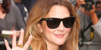 Drew Barrymore was seen wearing the iconic Ray-Ban Wayfarer 2140 901 Black sunglasses in an oversized size
