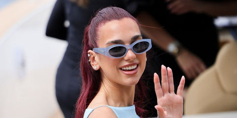 Dua Lipa wears Jacquemus JAC 4 C5 Sun Blue Cat Eye Sunglasses at the Jacquemus 15th Anniversary Fashion Show 'La Casa' in Capri, Italy