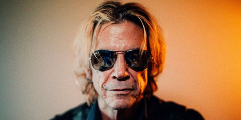 Guns N' Roses bassist Duff McKagan was seen wearing gunmetal Ray-Ban Aviator 3025 004/58 Polarised sunglasses in the promotional image of his new single Holy Water / I Wanna Be Your Dog.